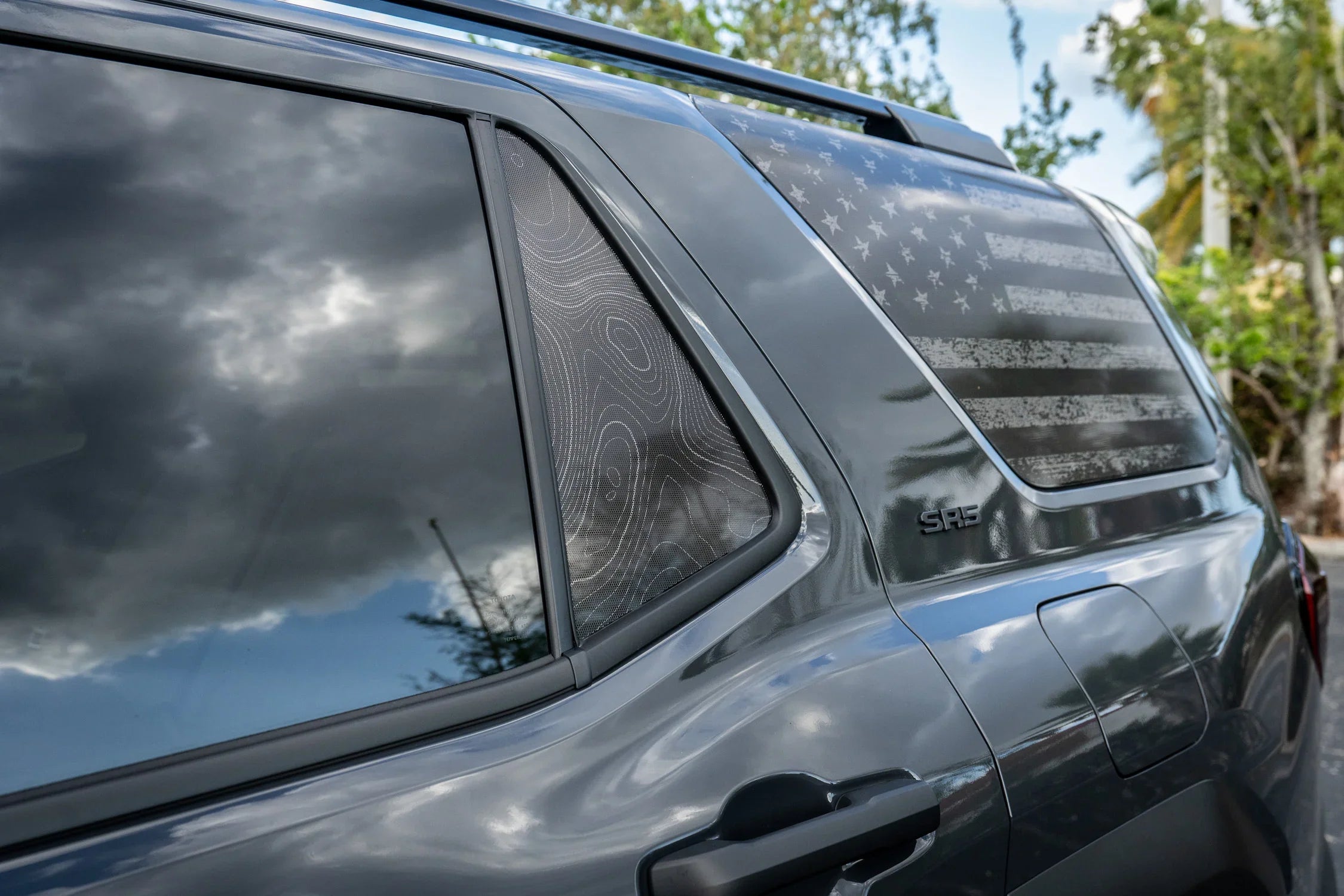 Topographic rear vent window overlay vinyl in carbonized gray with perforated lines for 2025+ Toyota 4Runner exterior accessories