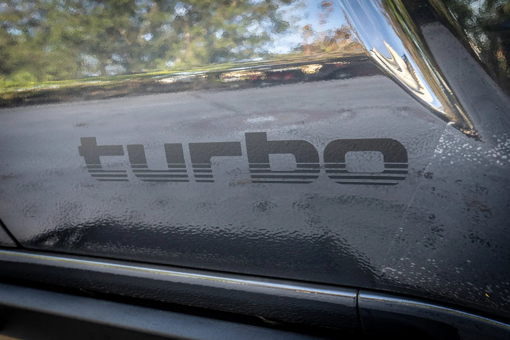 Pair of matte black Turbo Retro Style Graphic Fender Decals by StickerFab for vehicle exterior vinyl decoration.
