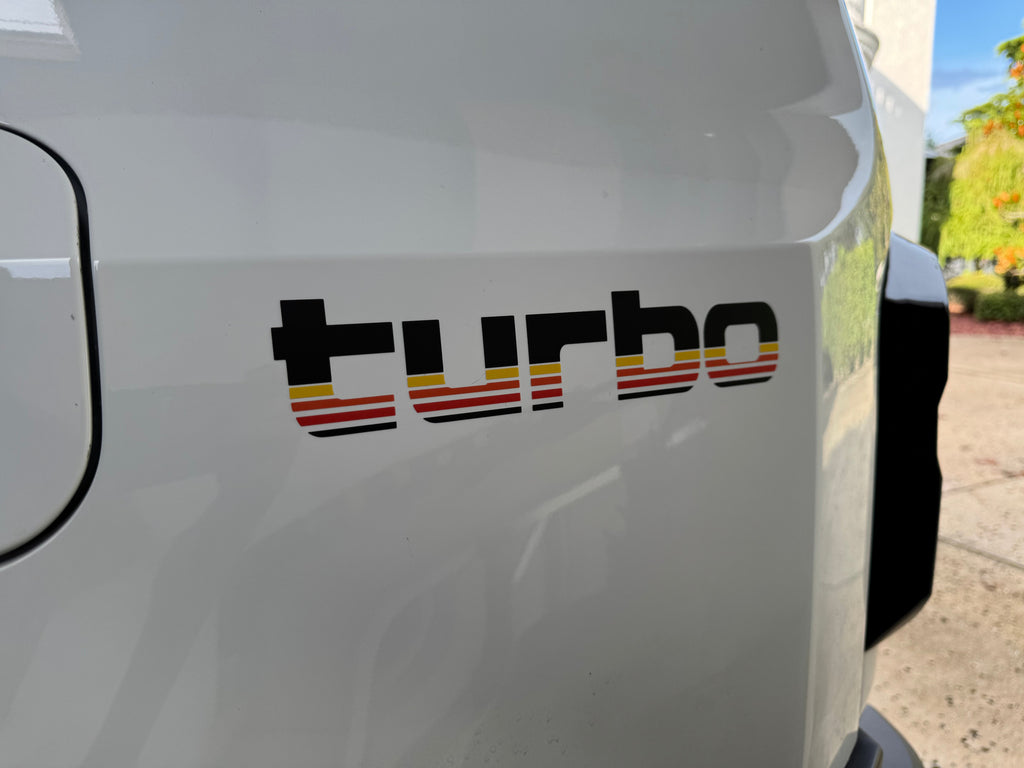 Pair of matte black Turbo Retro Style Graphic Fender Decals from StickerFab, universal exterior vinyl decals for cars.