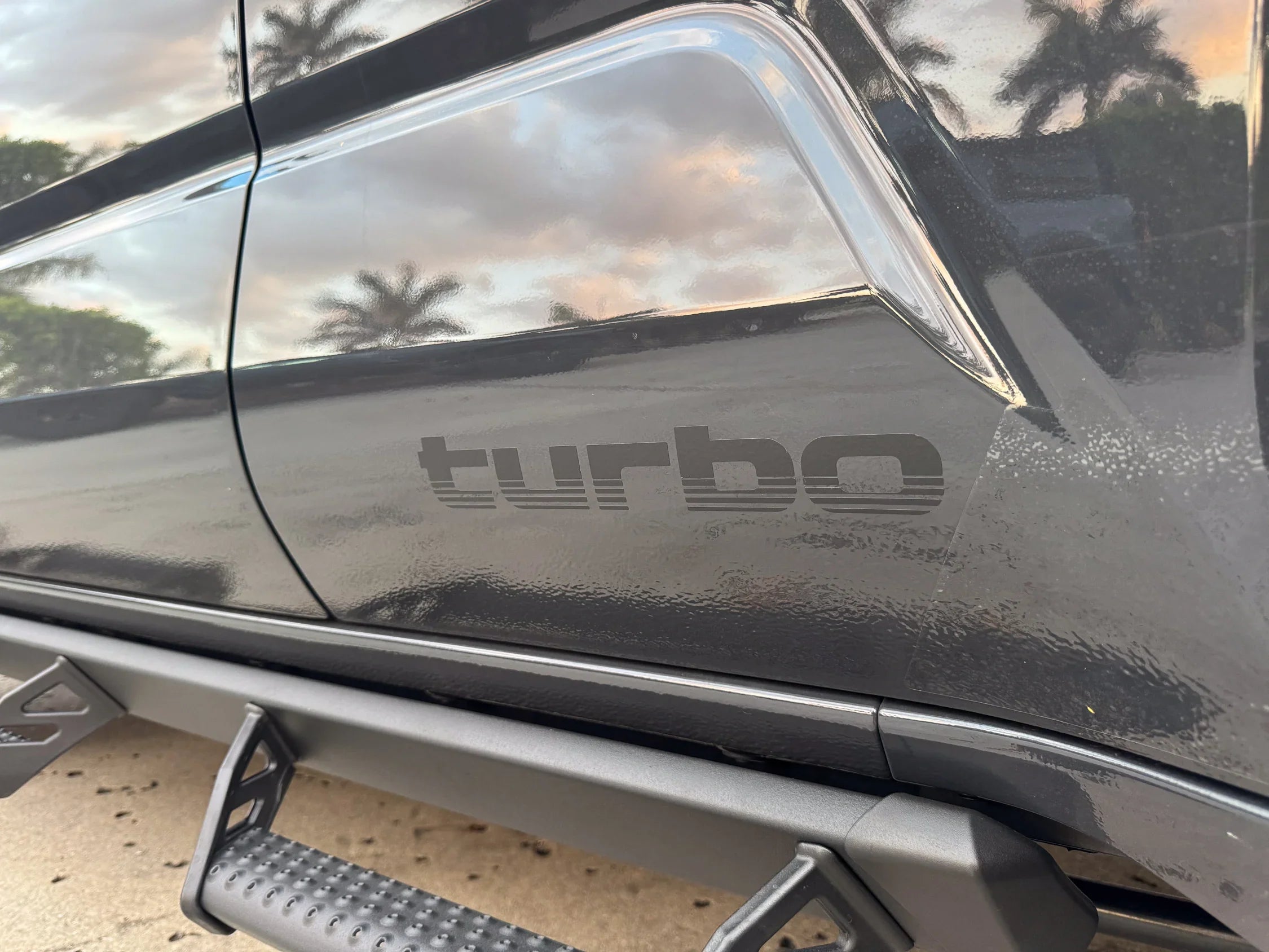 Pair of matte black Turbo Retro Style Graphic Fender Decals by StickerFab for vehicle exterior vinyl decoration.