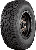 Yokohama Geolandar X-AT tires mounted on a vehicle, showcasing rugged tread pattern and sidewall branding for Vinyasa Automotive.